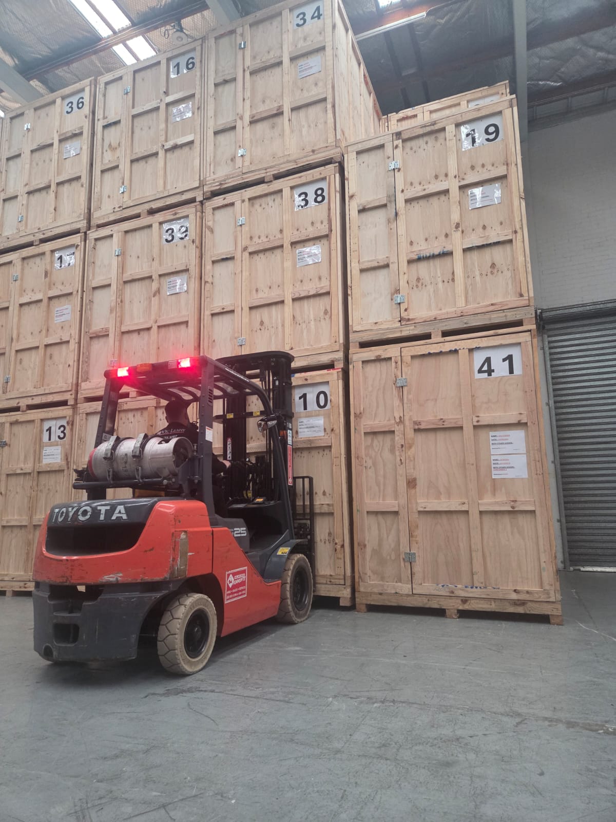 Vic Leahy storage crates and forklift in the warehouse