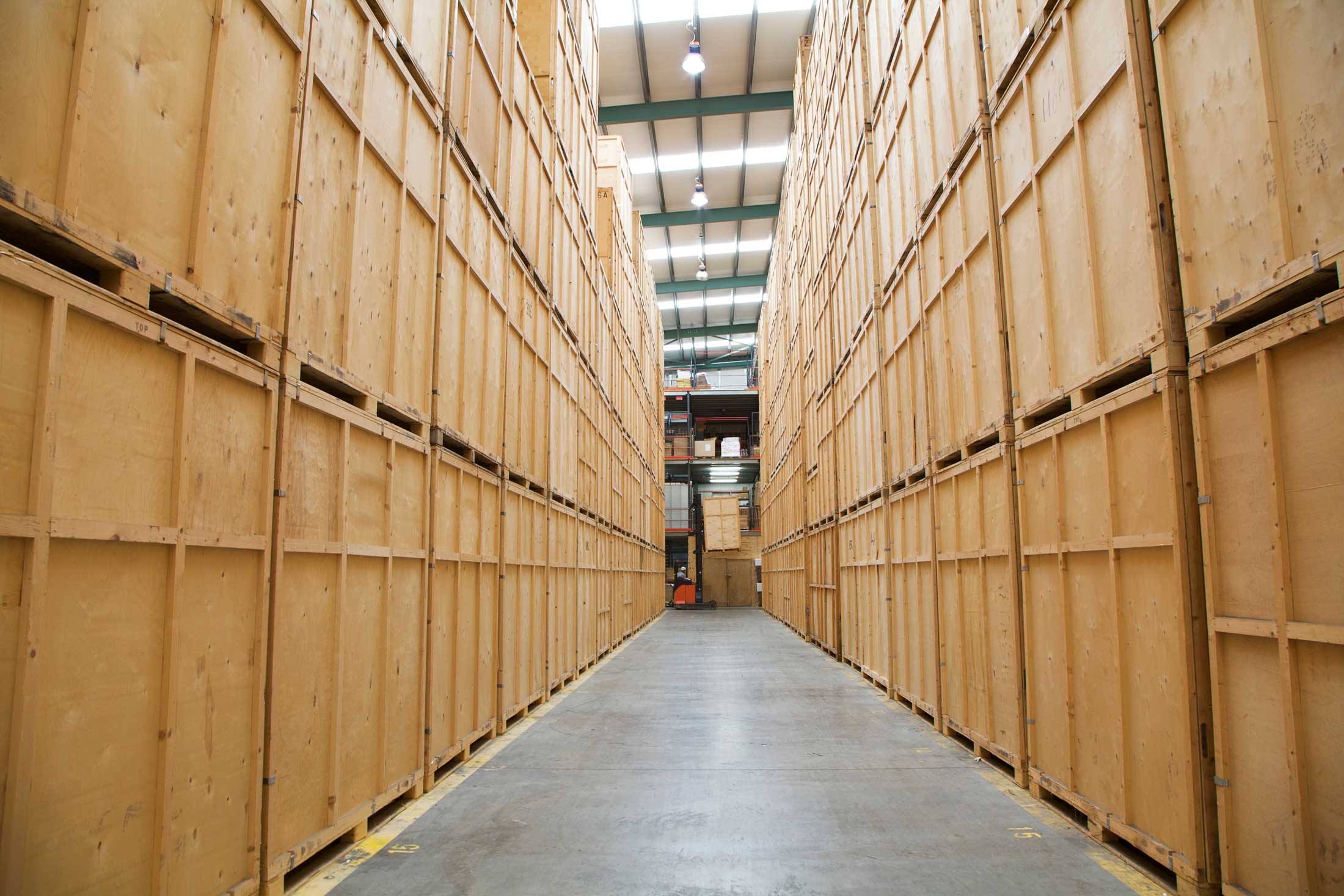 Aisle of timber storage pods in a warehouse